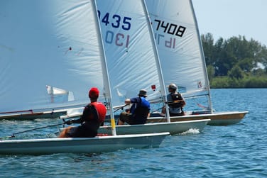 Laser sailboats at starting line