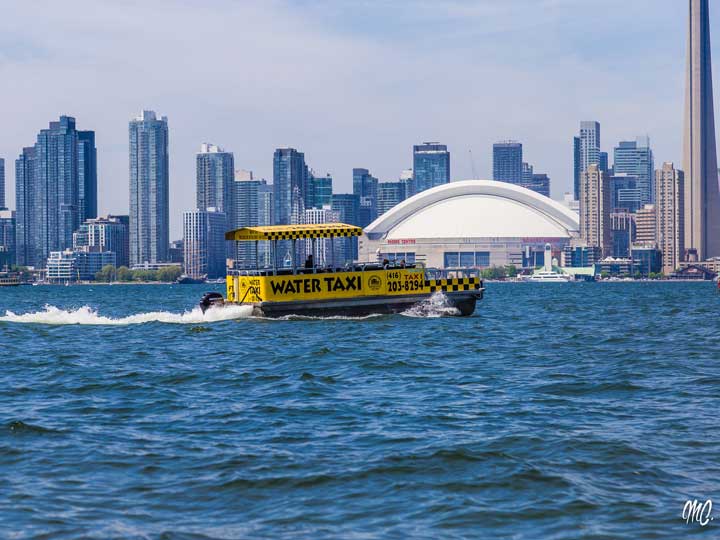 Water taxi with city skyline
