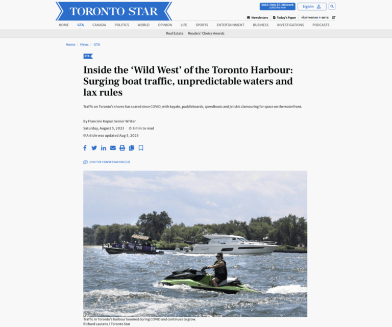 Screenshot of newspaper with photo of boats