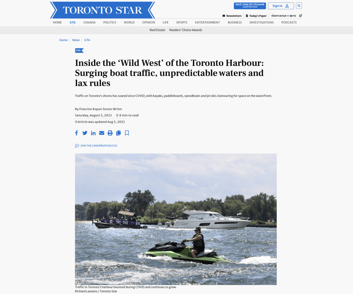 Screenshot of newspaper with photo of boats
