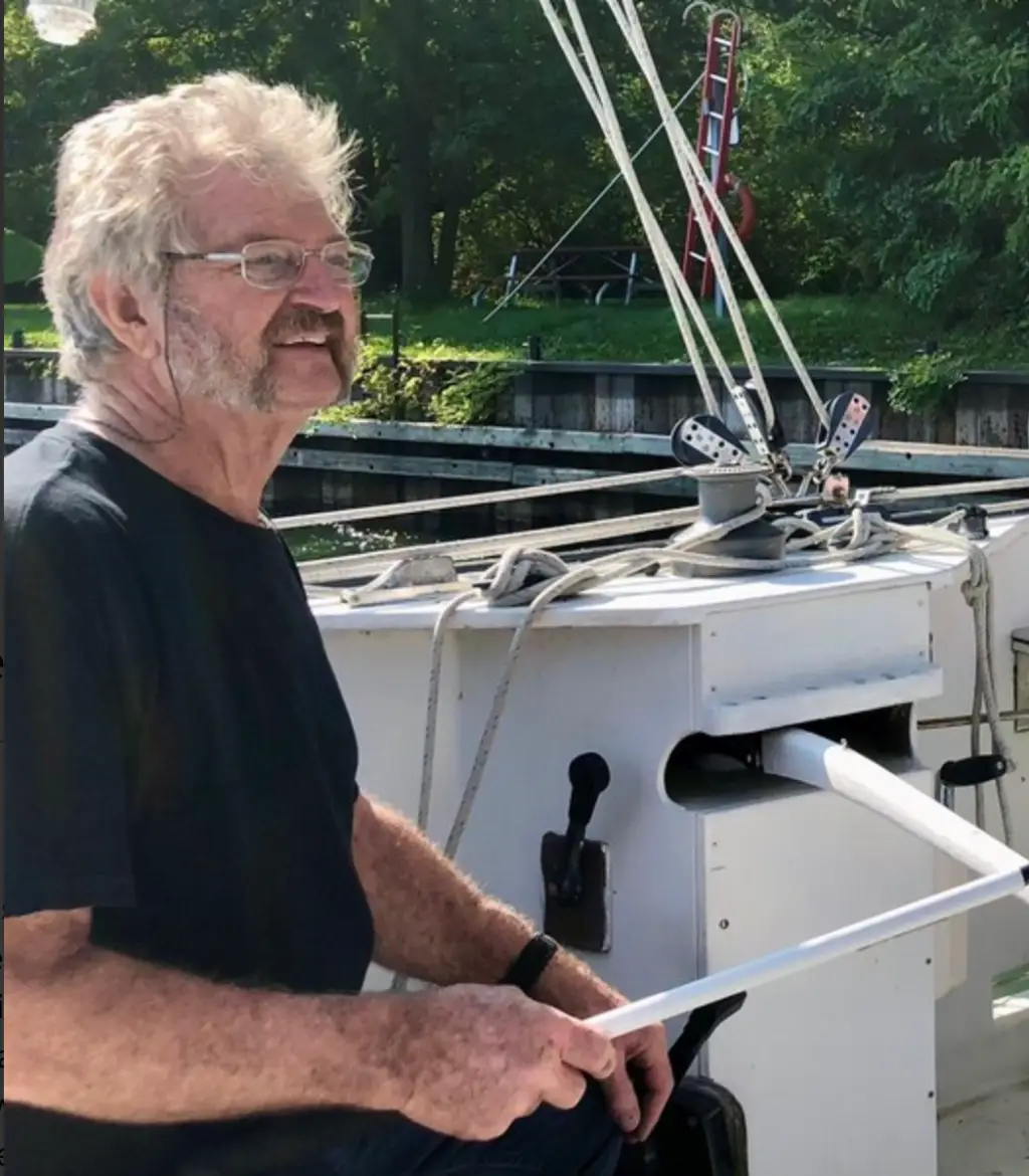 Man smiling on a sailboat